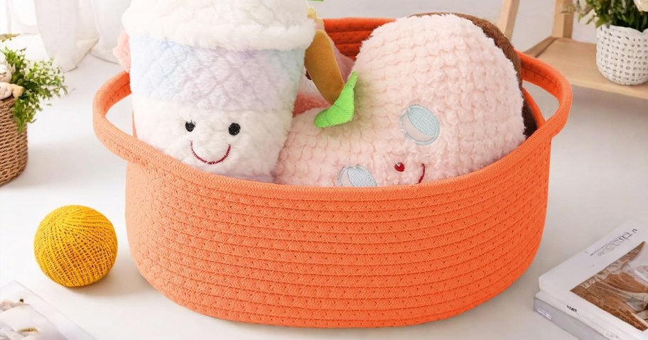 stuffed animals in an orange rope basket