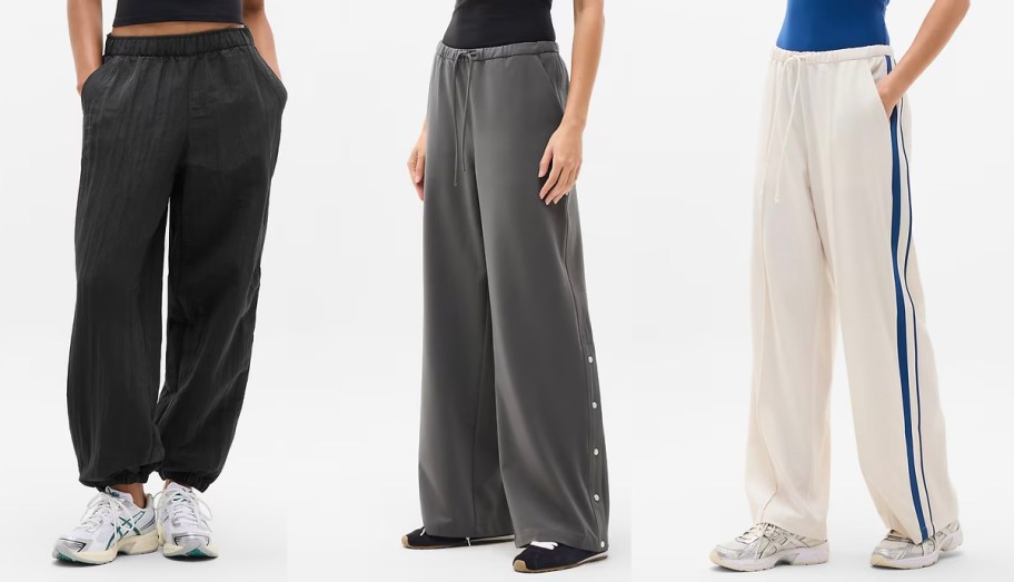 three women wearing black, gray, and white pants 