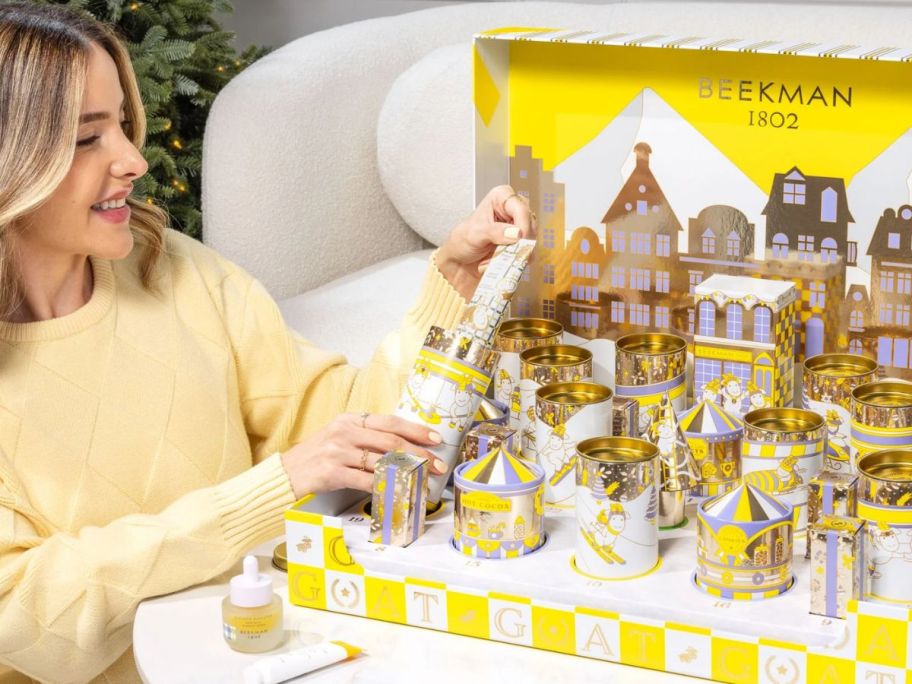 woman holding product from The G.O.A.T. 2025 Advent Calendar
