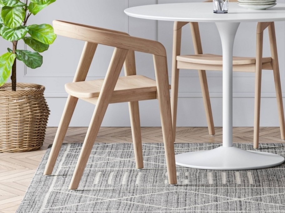 a natural colored wooden dining chair