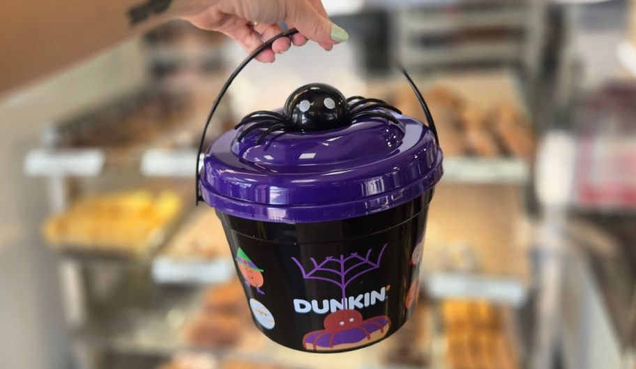 a woman hand holding a muchkin bucket 