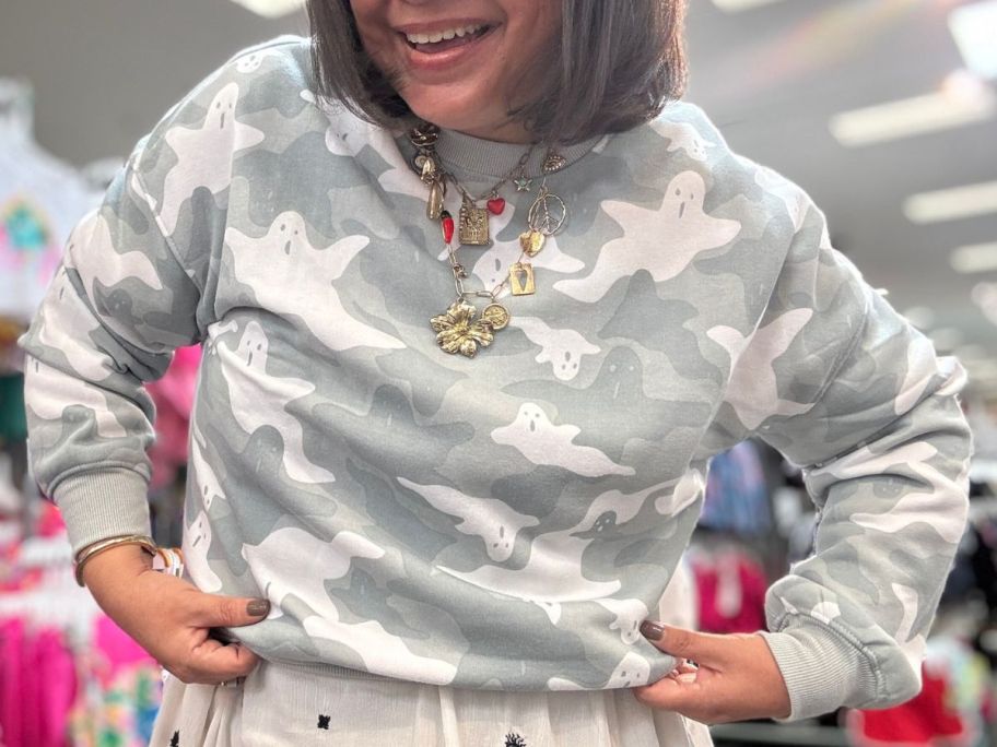 Woman wearing ghost sweater inside of target shopping store