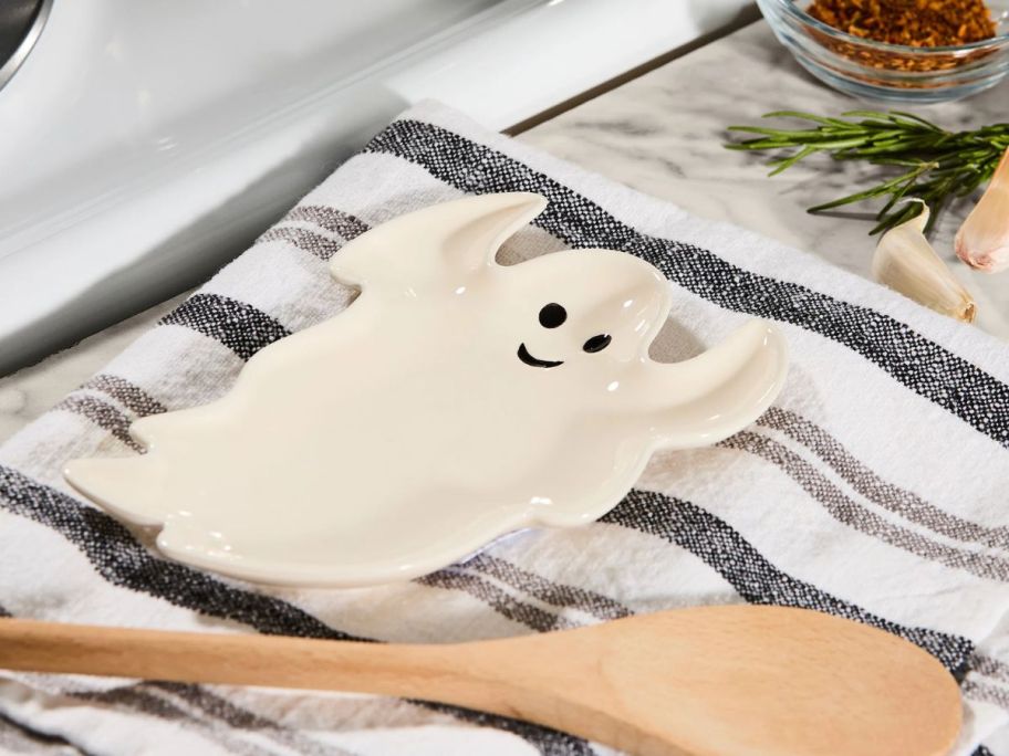 Way To Celebrate Ghost Ceramic Spoon Rest on towel on counter
