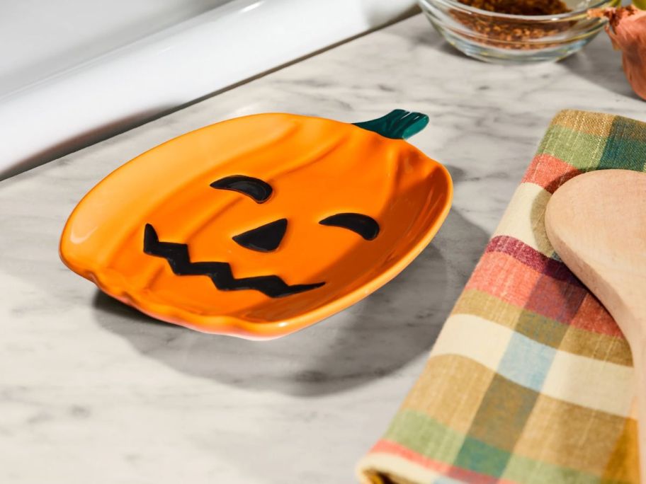 Way To Celebrate Pumpkin Ceramic Spoon Rest on counter