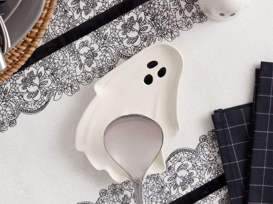 Ghost-Shaped Ceramic Spoon Rest with spoon on it on tablecloth