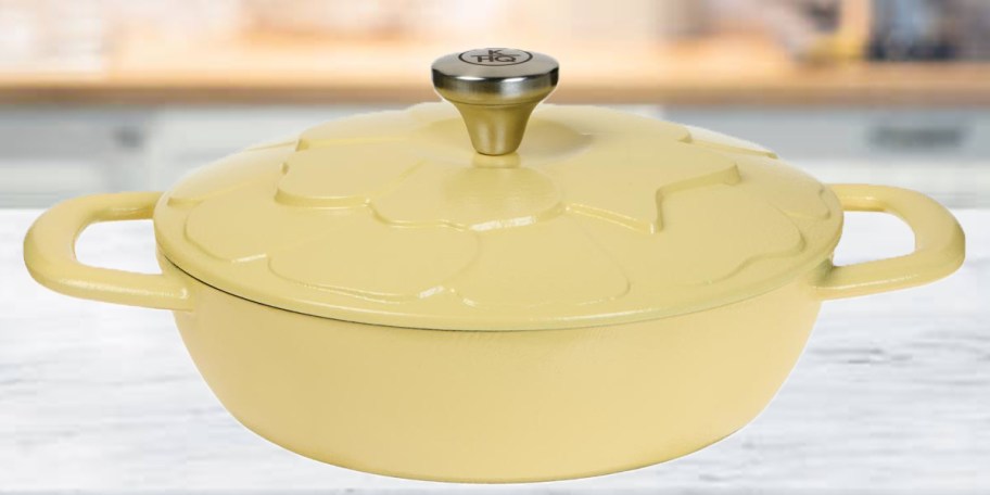 yellow floral cast iron on countertop 