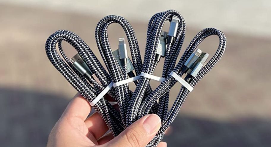 hand holdling iphone charger