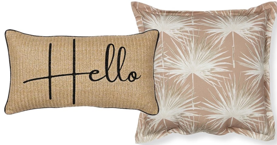 a rectangle throw pillow with "Hello" on it and a square throw pillow with palm trees on it