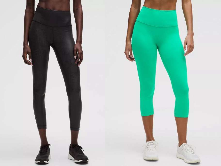two women in black and green leggings