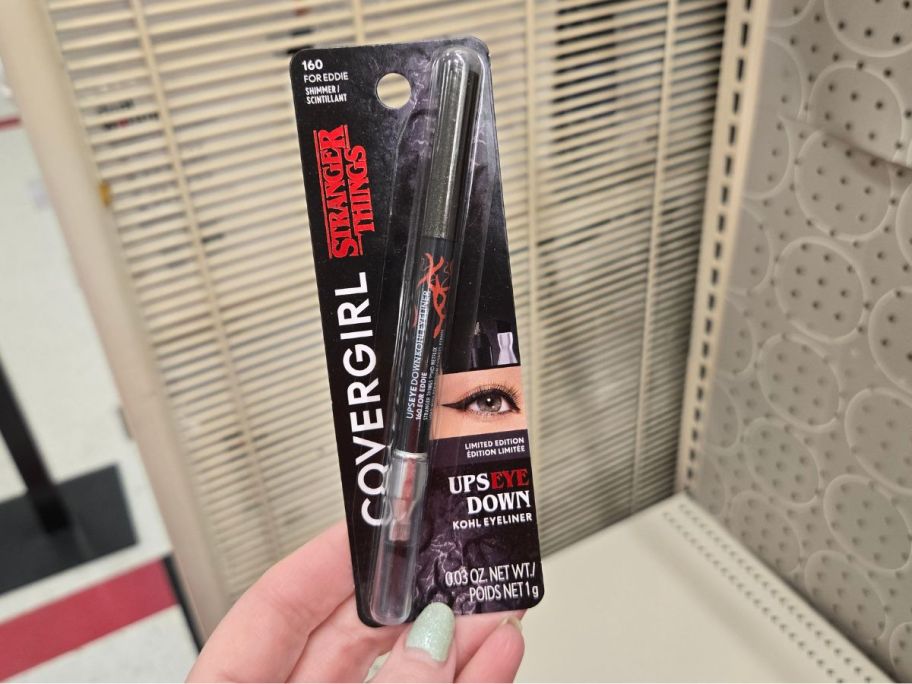 black COVERGIRL x STRANGER THINGS UpsEYE Down Kohl Eyeliner in hand in store