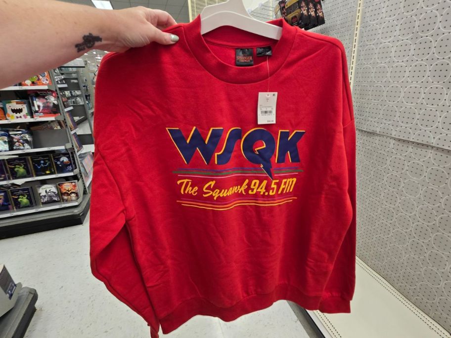 red Stranger Things Men's WSQK Fleece Pullover Sweatshirt in hand in store