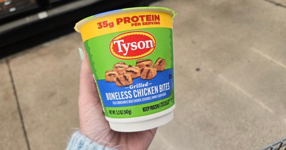 hand holding a Tyson Chicken Cup with grilled chicken bites