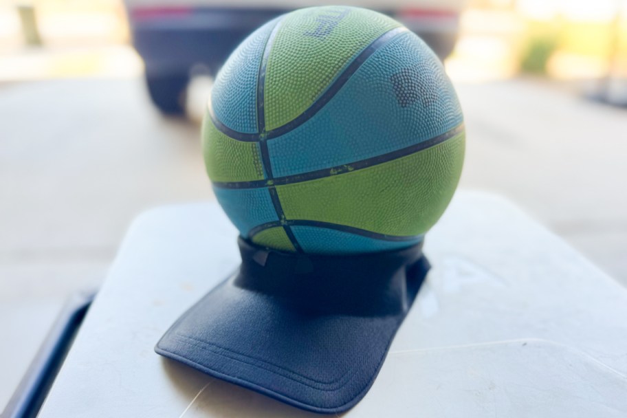 blue and green basketball on black hat