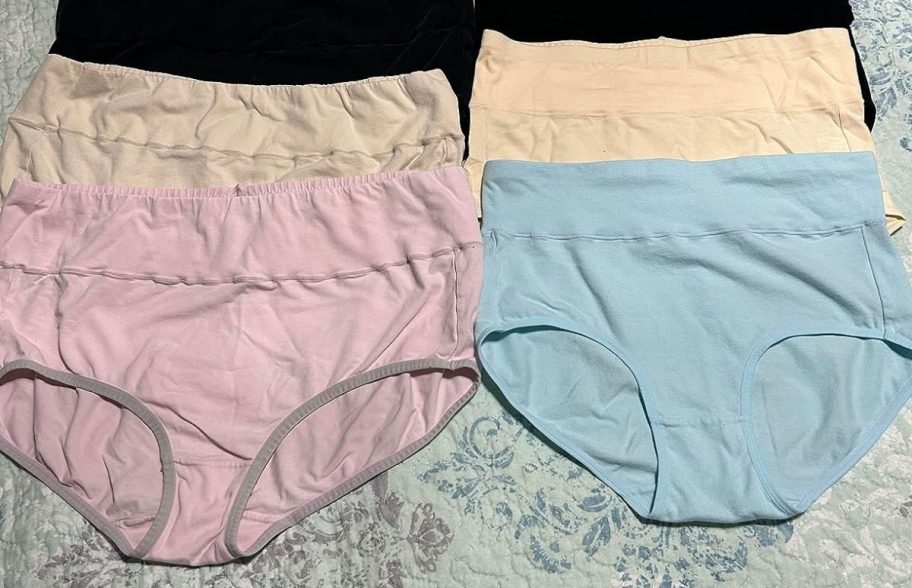 four women's panties on bed