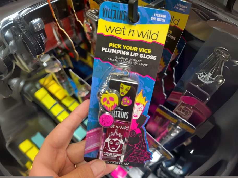 Wet N Wild Disney Villains Pick Your Vice Plumping Lip Gloss in hand in store