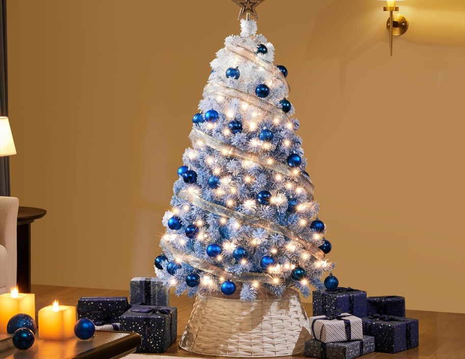 white and blue christmas tree with white and blue bulb decorations 