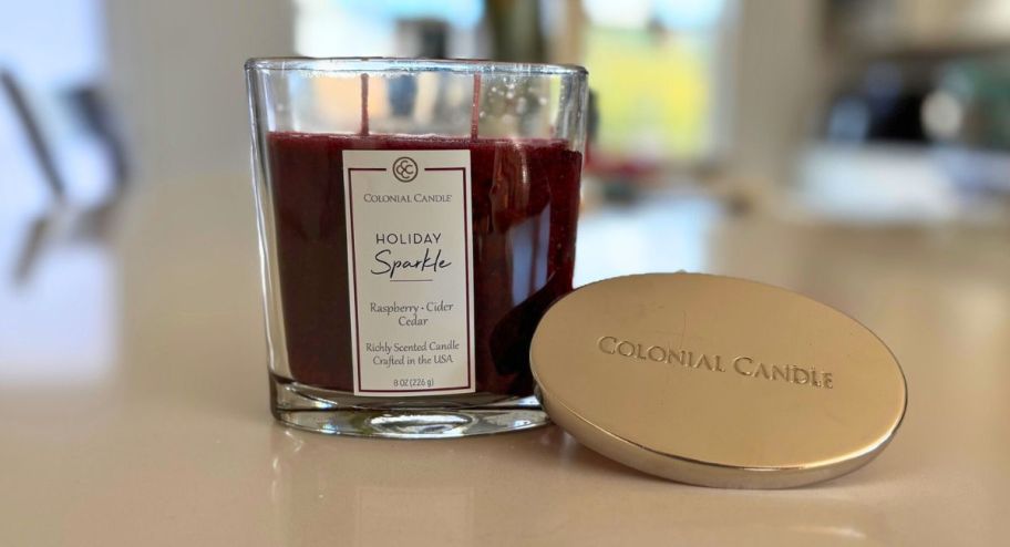 display of Colonial Candle Holiday Sparkle Classic Oval 8oz Jar on top of the table