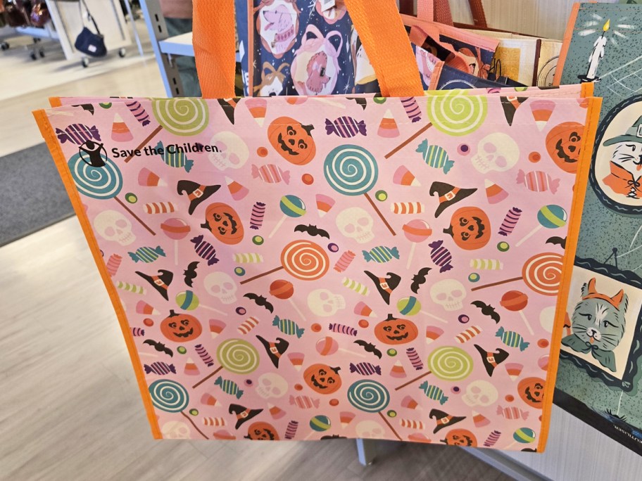 pink and orange halloween candy print shopping tote bag