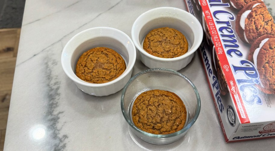 ramekins with little debbie oatmeal creme pies inside 