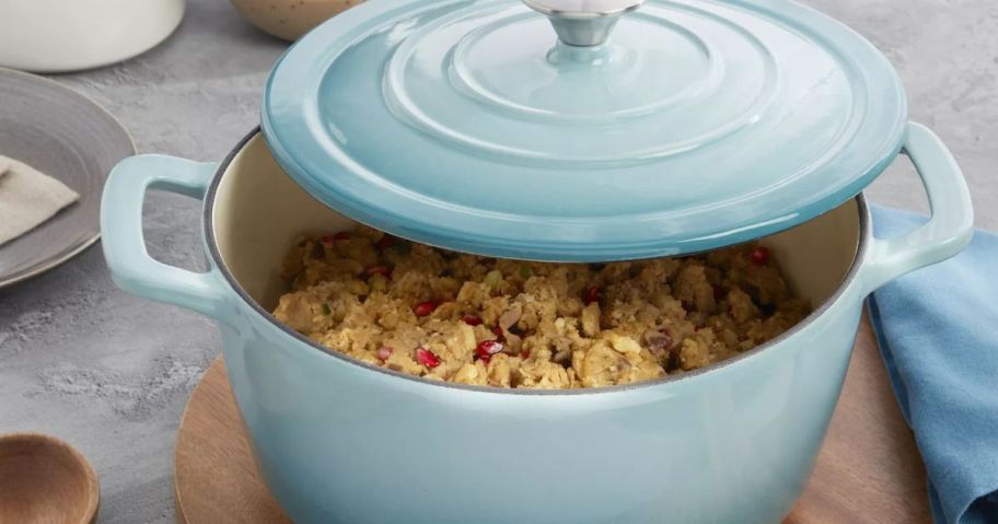 A blue mingle dutch oven with food inside