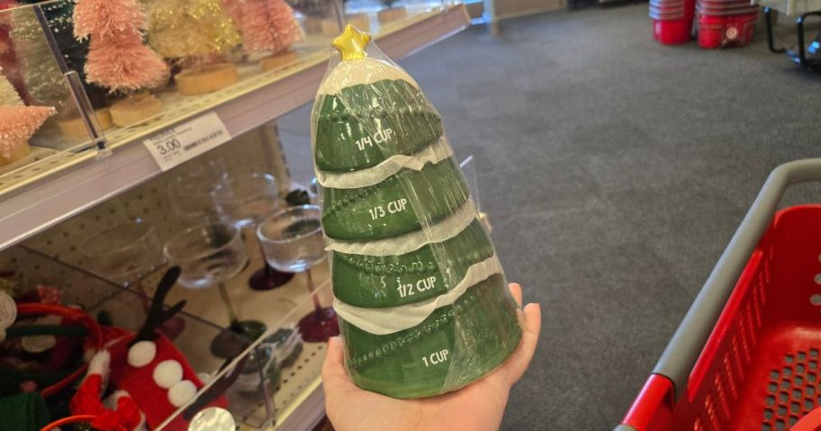 A person holding a ceramic Christmas Tree 
