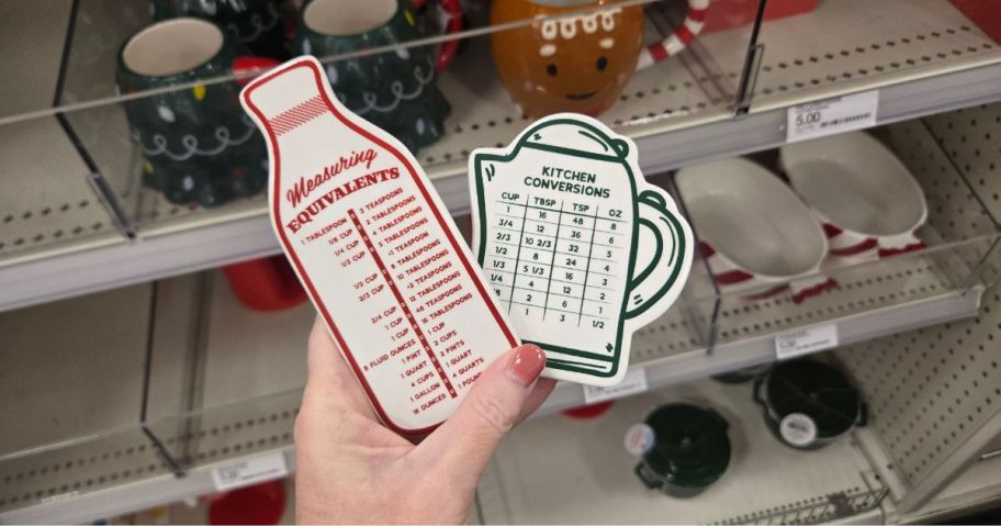 A person holding two measuring conversion