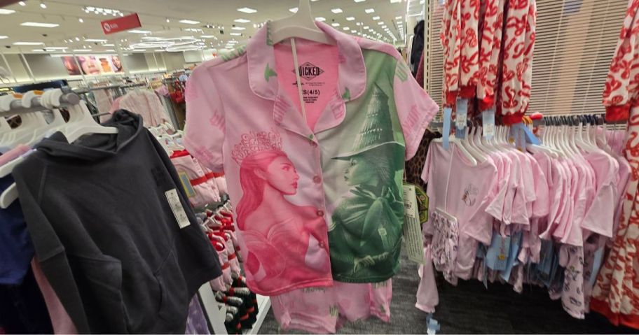 A person holding a Wicked pajama set