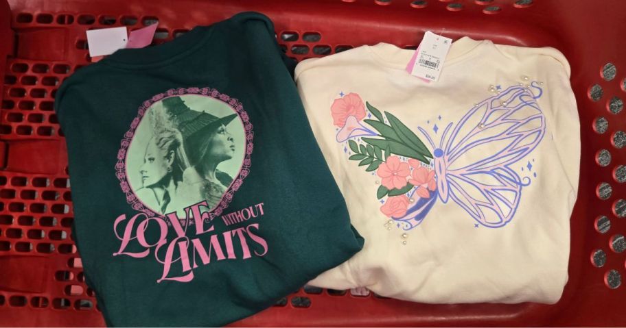 2 sweatshirts in a Target cart: one green, the other white