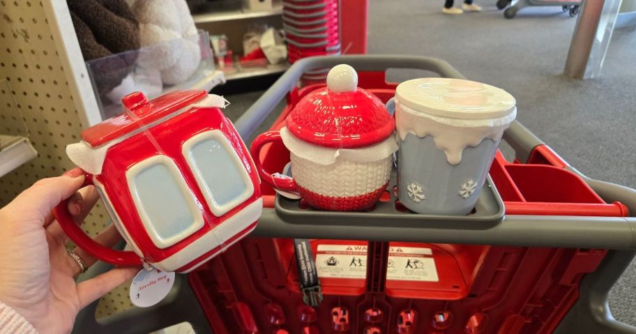 Lidded Ceramic Christmas themed Mugs in a red cart
