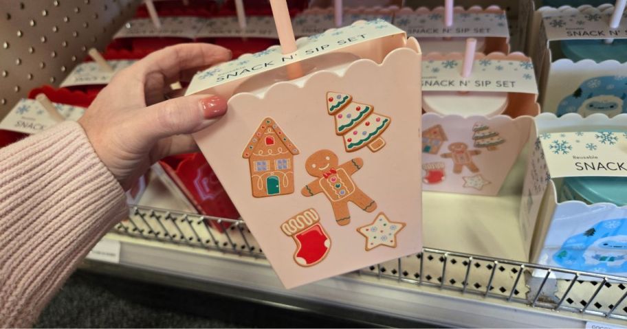 A person holding a Christmas Snack & Sip Set