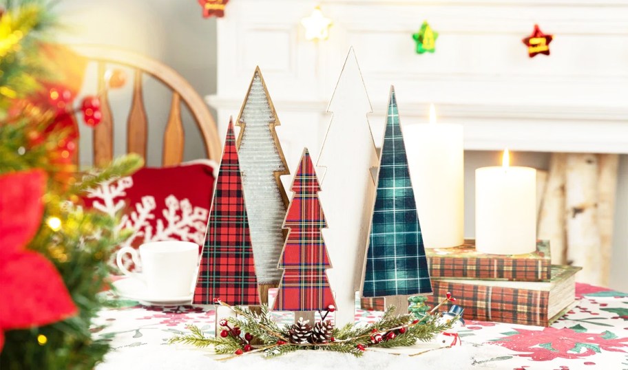 set of wooden christmas trees on a table
