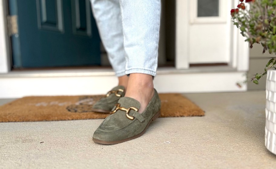 green suede loafers on front porch