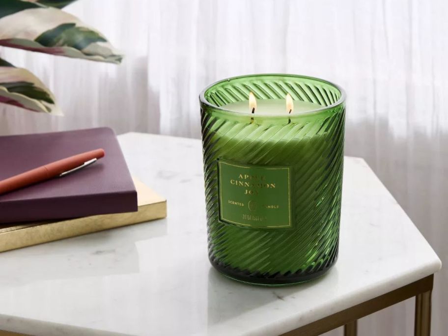 green Threshold Swirled Glass 20oz Jar Candle on table