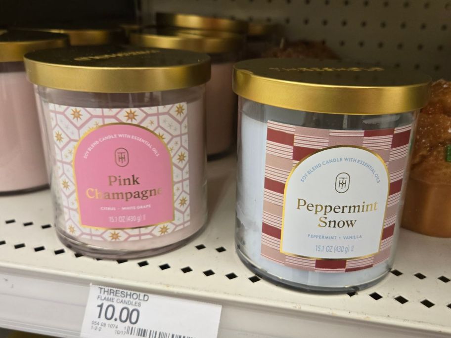 two Threshold 2-Wick Lidded 15.1oz Jar Candles on shelf in store