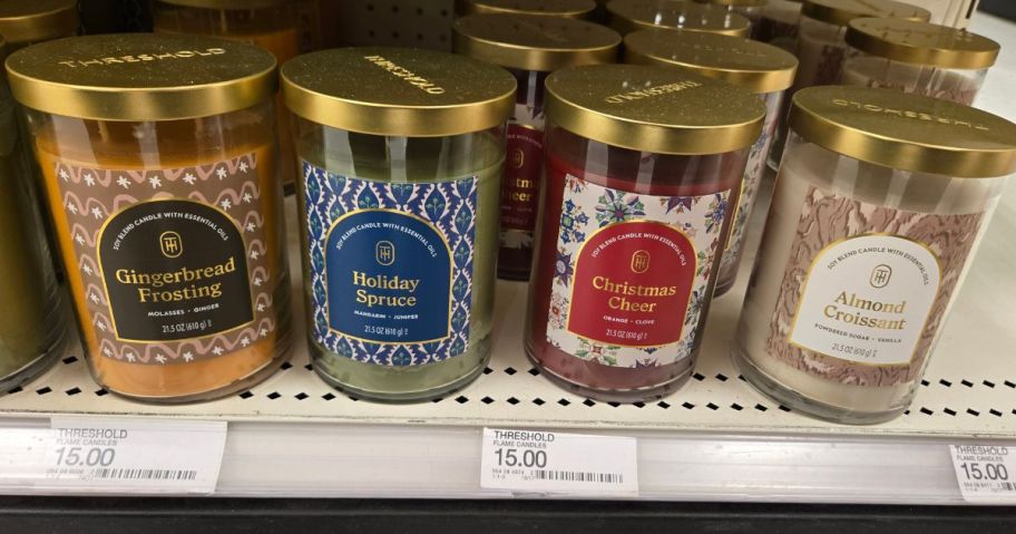 four Threshold 2-Wick Lidded 21.5oz Jar Candles on shelf in store