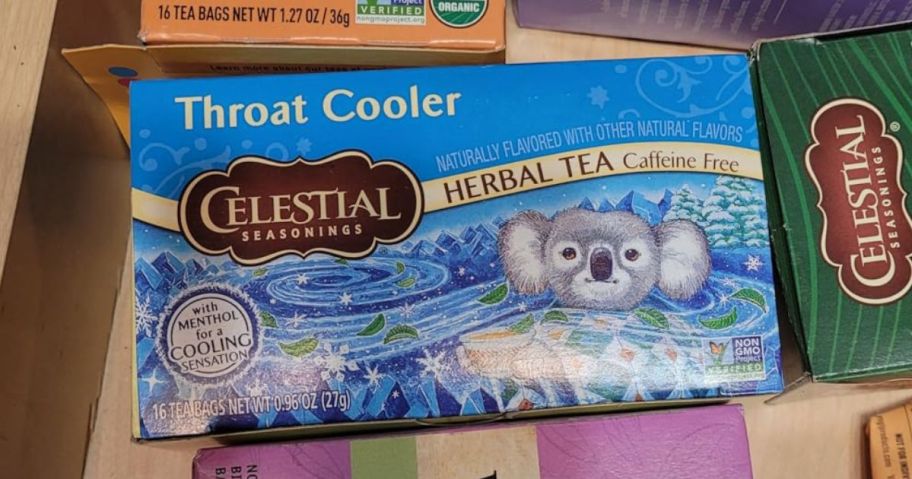 Celestial Seasonings throat cooler Herbal Tea 16-Count Box on table amongst other products
