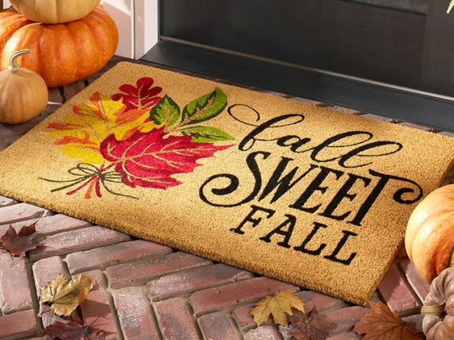 fall doormat with leaves on it 