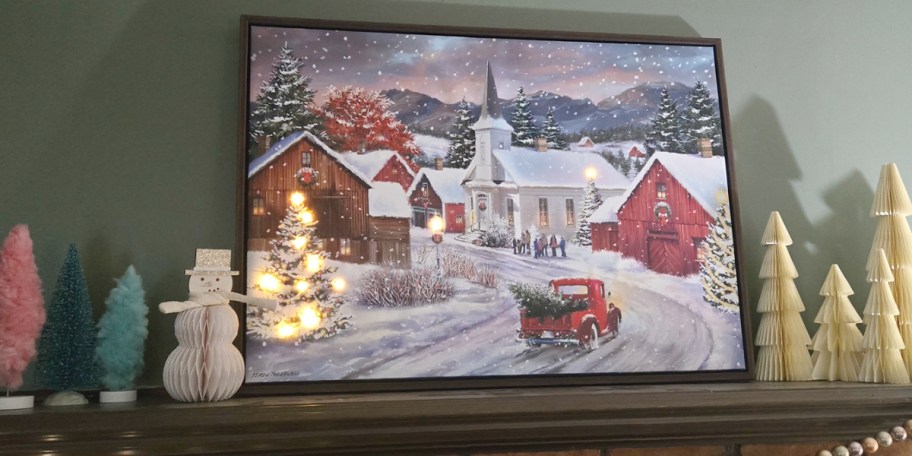 christmas village light up canvas on mantle