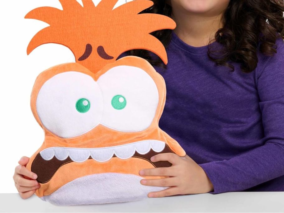 girl holding Flip-A-Mood Fear/Anxiety Reversible Plush