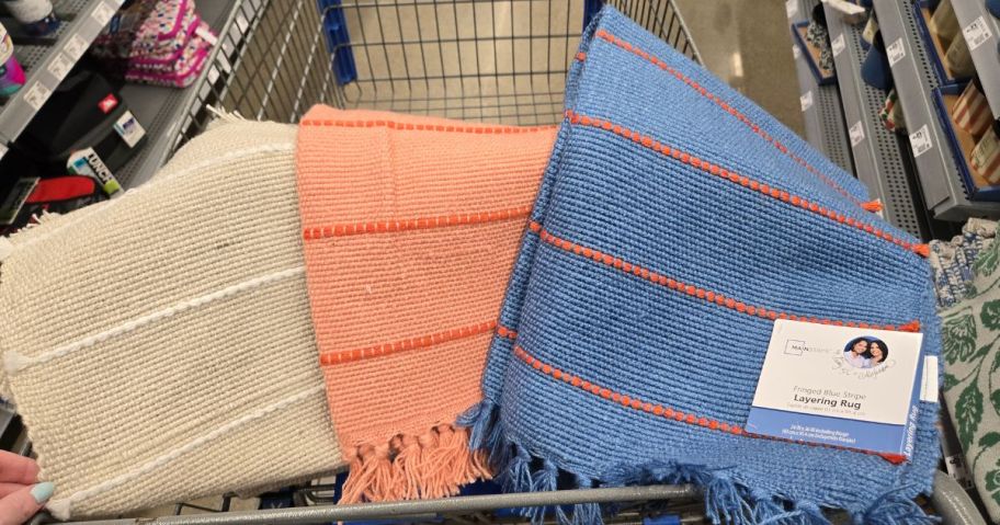 three layering rugs in cart in store