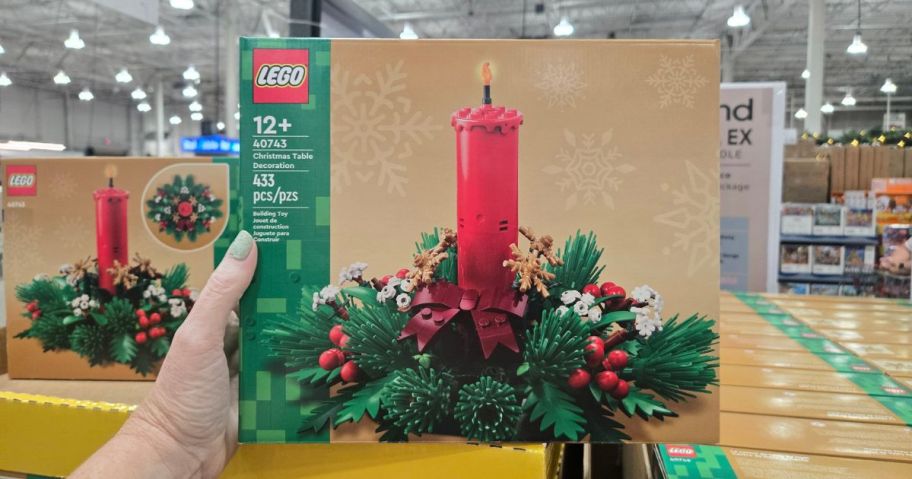 hand holding lego christmas centerpiece set box in hand in store