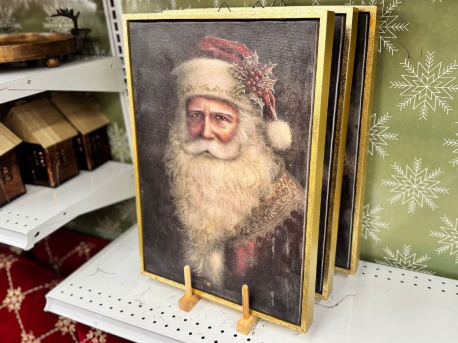 Snowy Santa & Sleigh Wall D&eacute;cor on shelf in store