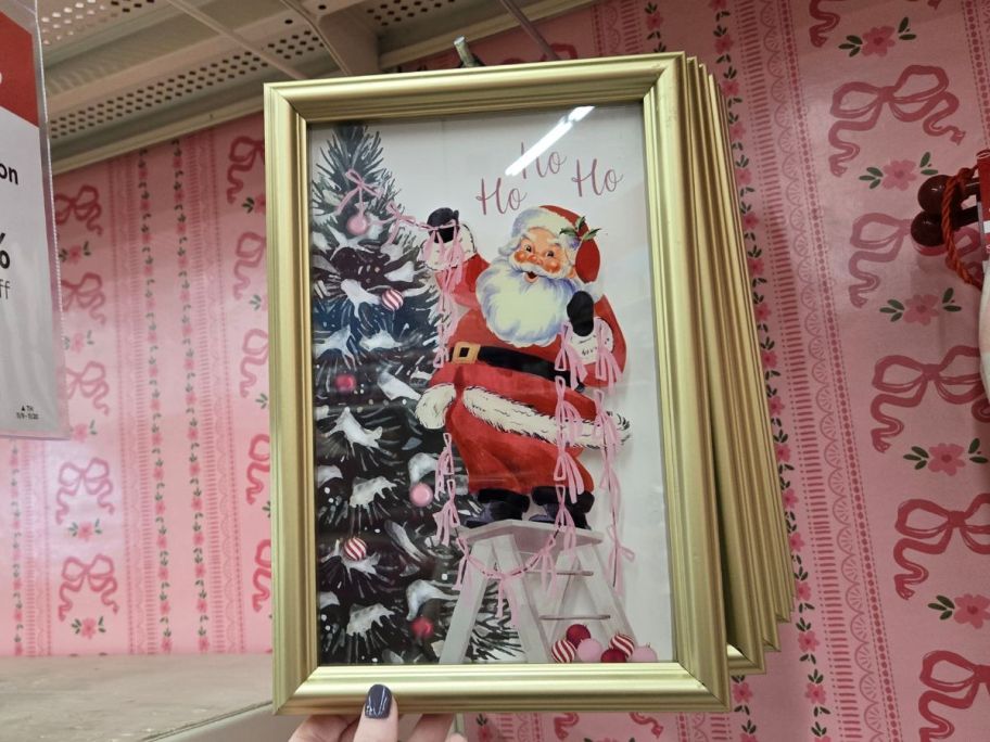 Santa Decorating Tree Wall D&eacute;cor hanging in store