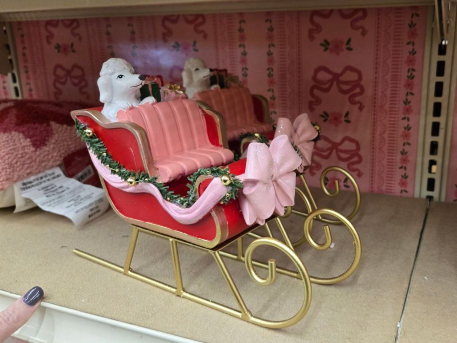 Sleigh w/ Poodle & Gifts Tabletop D&eacute;cor on shelf in store