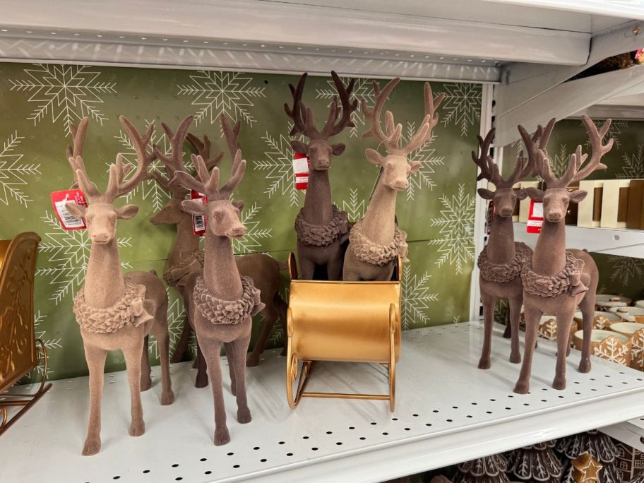 Flocked Standing Deer D&eacute;cor on shelf in store