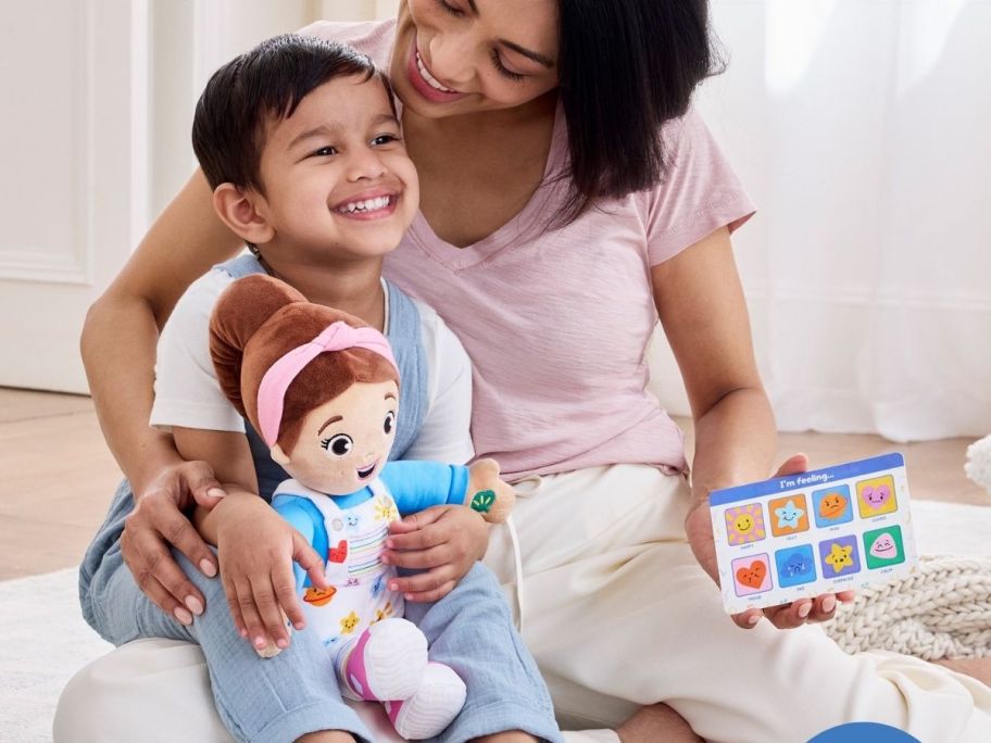 a mom and little boy with the ms rachel doll
