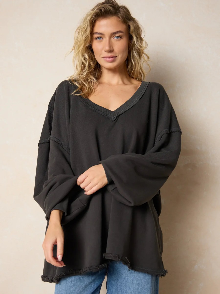 woman modeling dark gray sweater