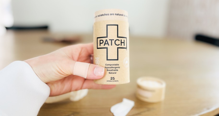 hand holding patch bandages