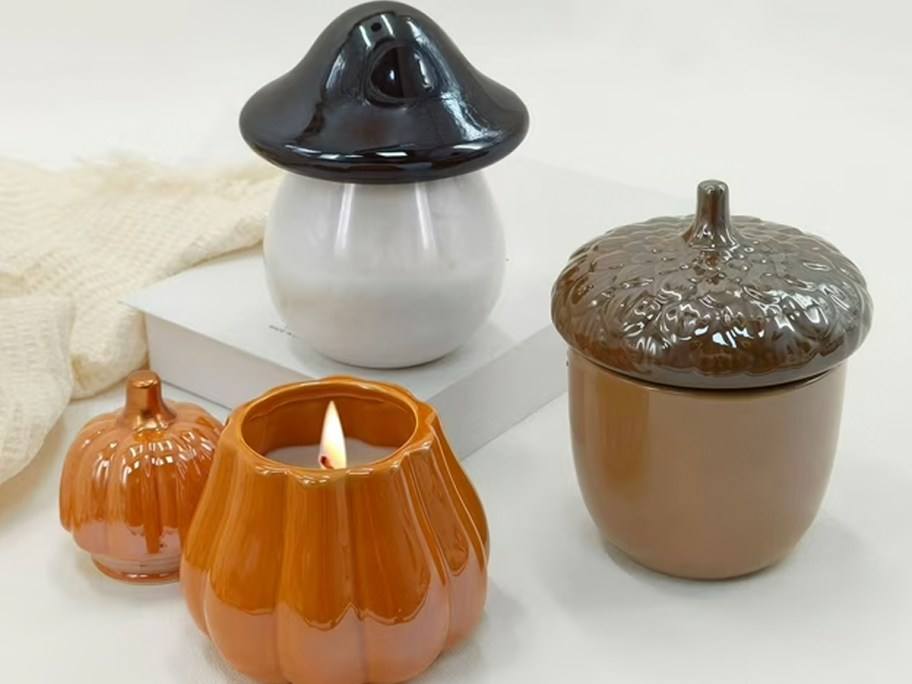 pumpkin, acorn, and mushroom ceramic candles 