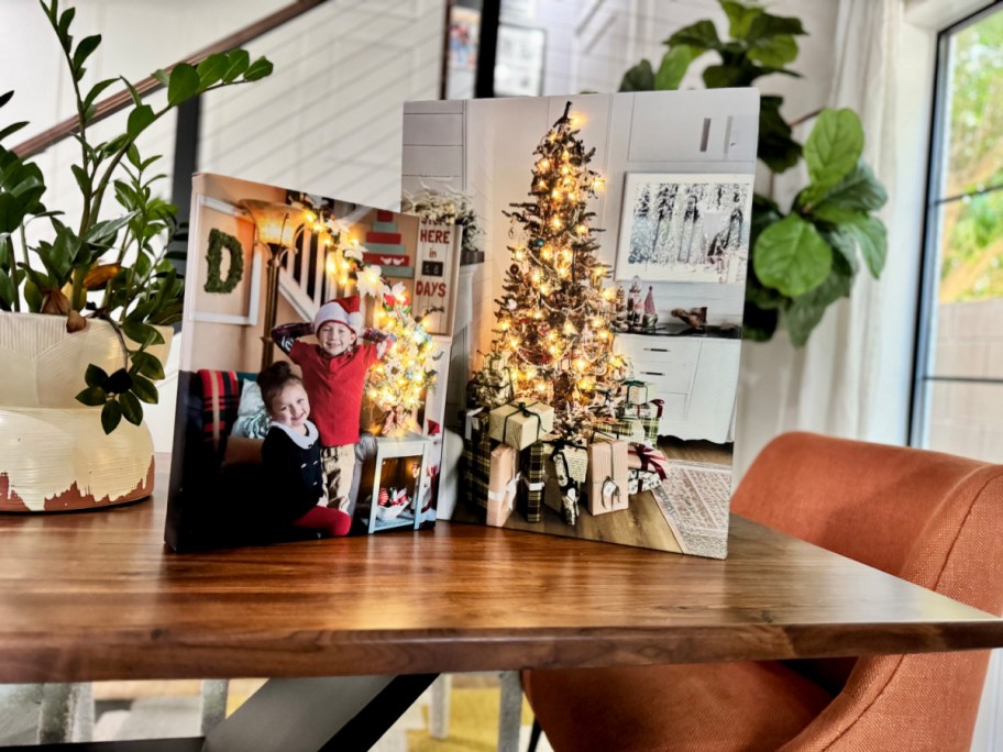 two light up photo canvas on a table 